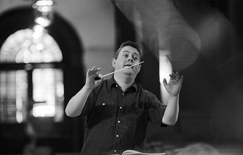 Andrew Morley  -conductor and Music Director