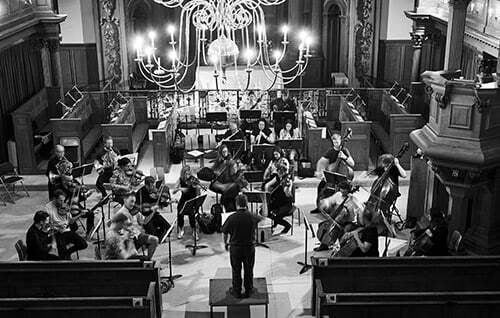 St Paul's Sinfonia orchestra on stage in concert